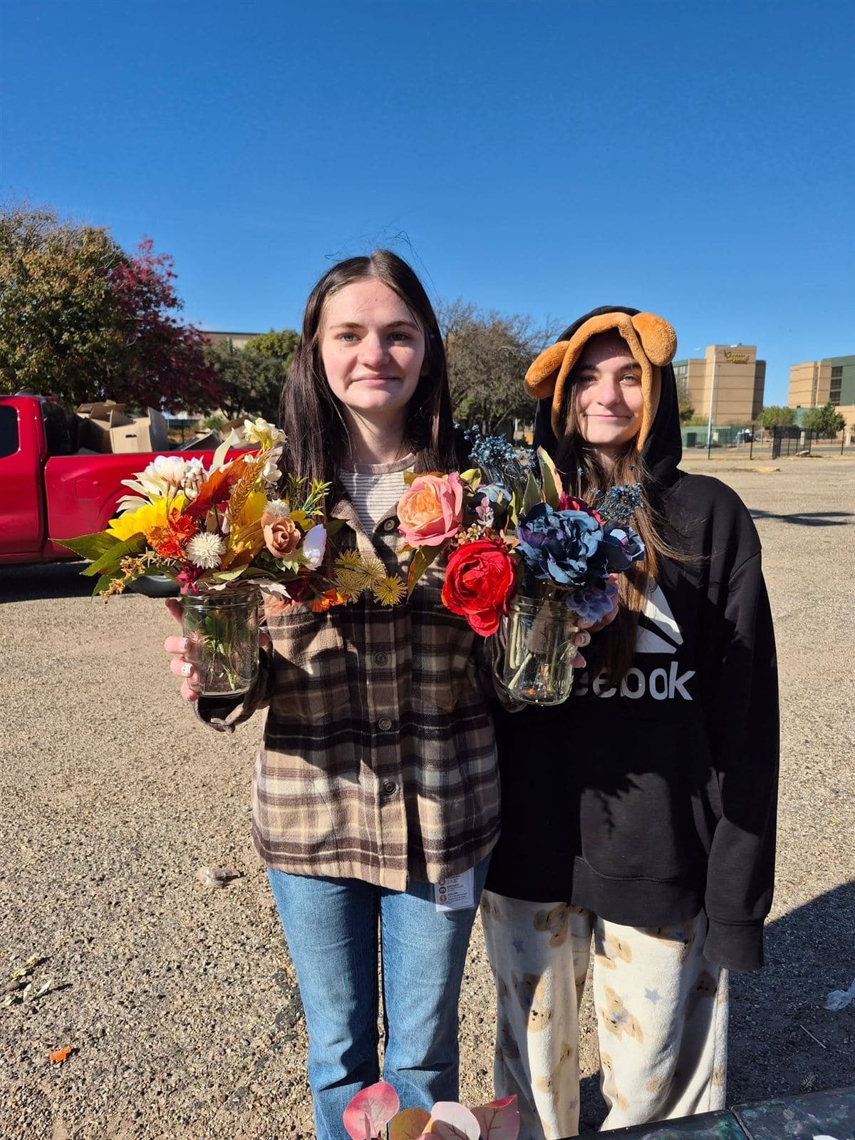 Two young women holding their bouquets