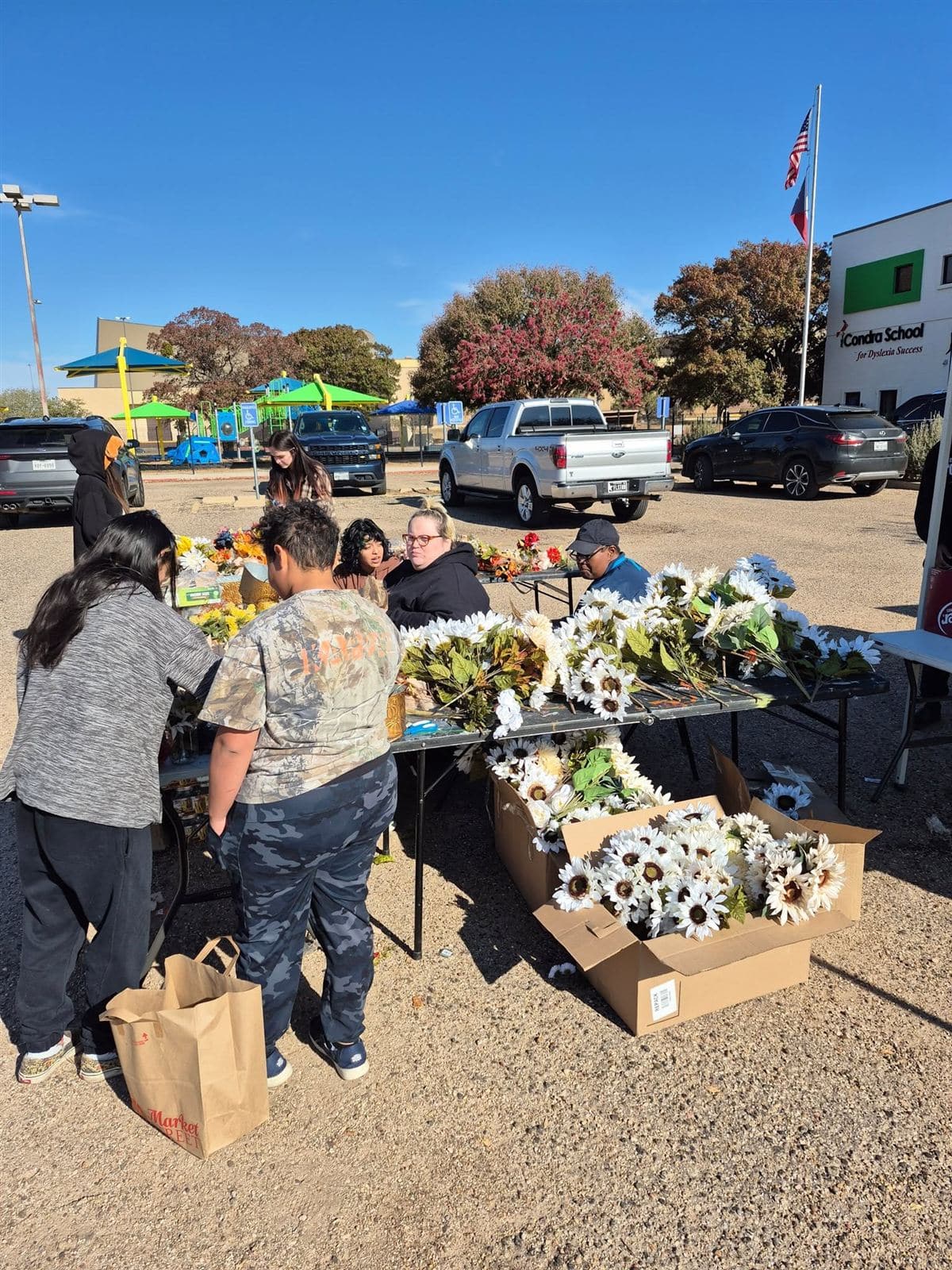 Neighbors choosing stems at the flower tables