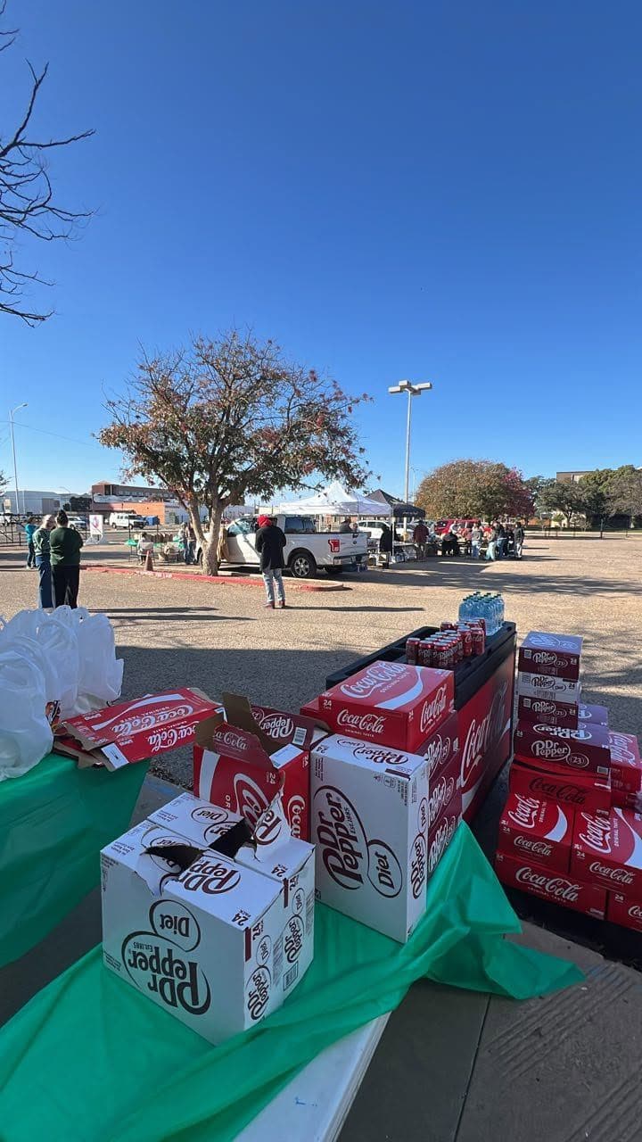 The drinks table stacked with cases of soda